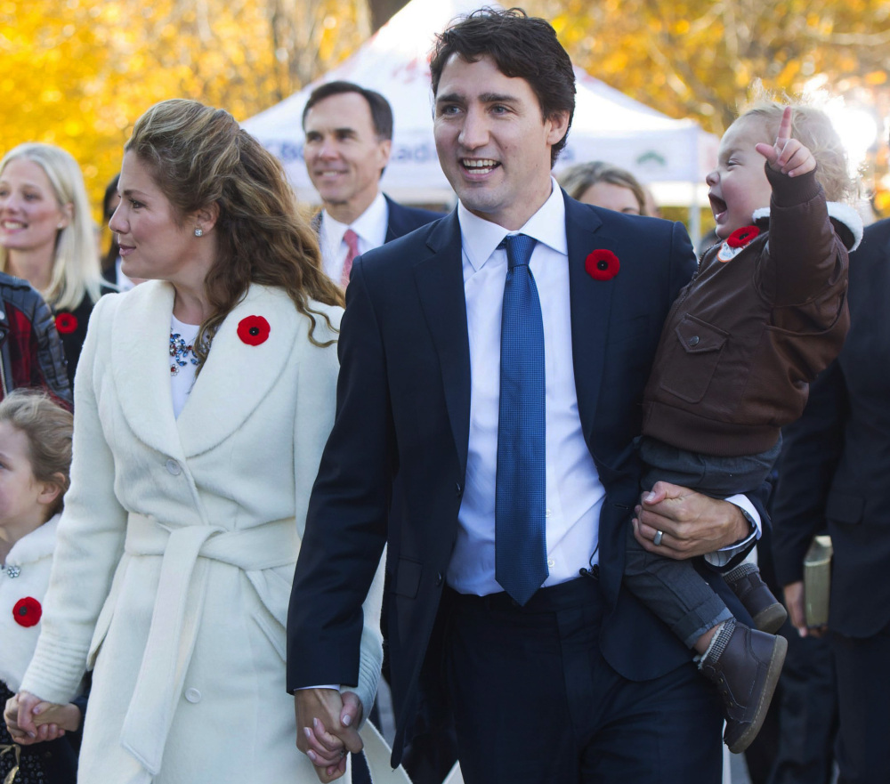 Justin Trudeau, shown with wife Sophie Gregoire-Trudeau and their children, becomes the second youngest prime minister in Canadian history.