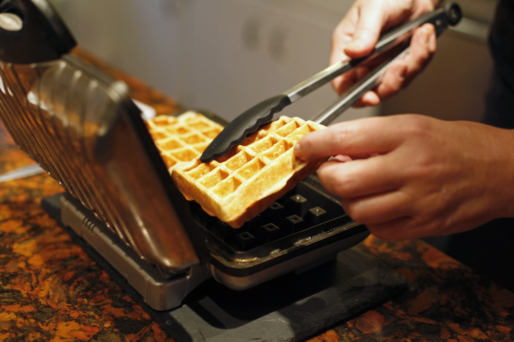 Christine Burns Rudalevige makes banana waffles.
Photos by Jill Brady/Staff Photographer