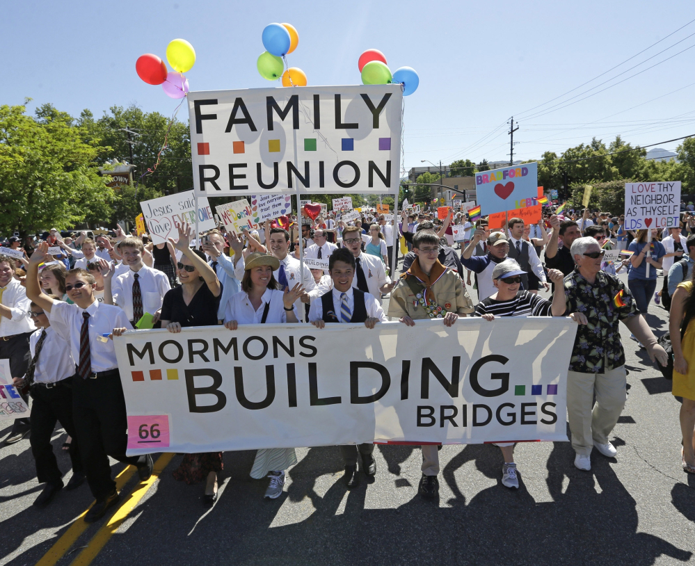 Members of the Mormons Building Bridges march during the Utah Gay Pride Parade in Salt Lake City in 2013, but overall the church has been slow in accepting homosexuality.