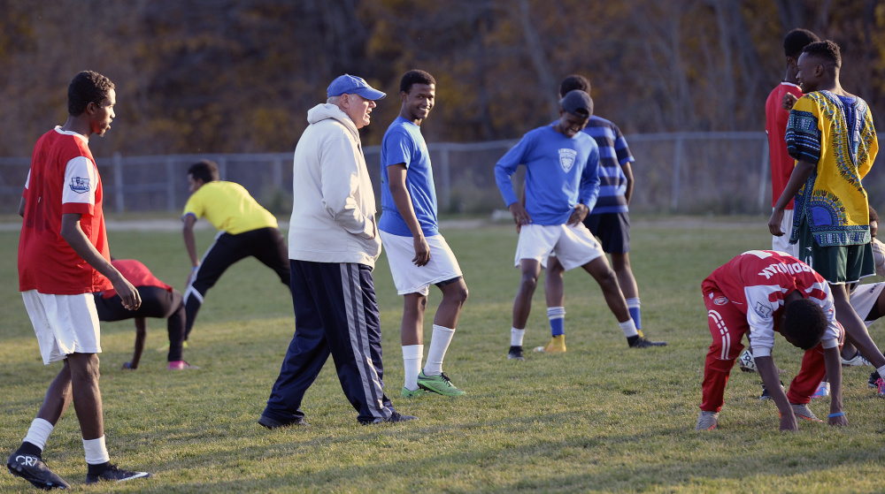 Lewiston coach Mike McGraw jokes with his players during practice Thursday. 
Shawn Patrick Ouellette/Staff Photographer