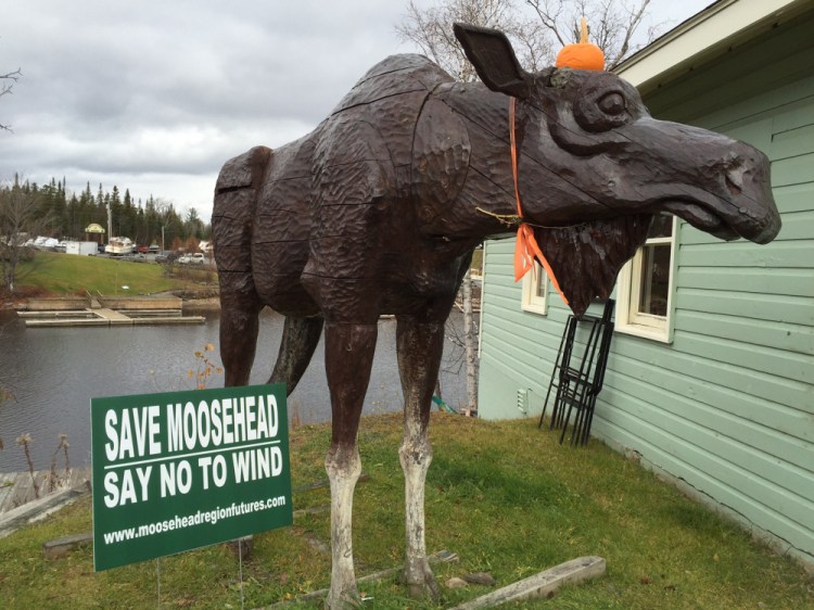 Anti-wind signs, such as this one in Rockwood, are common sights around Moosehead Lake. SunEdison had planned to meet with local residents in September to brief them about its plans. That meeting was canceled and isn’t likely to be rescheduled until next summer, when seasonal residents return.