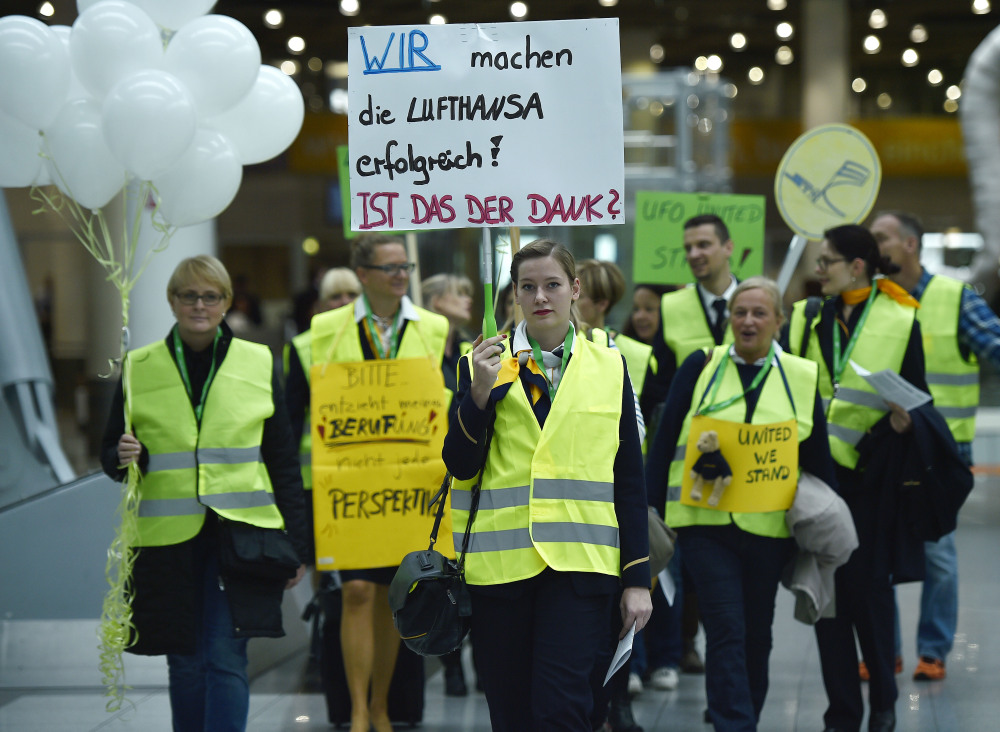 Lufthansa flight attendants protest at the airport in Duesseldorf, Germany, on Friday. The poster reads: “We make Lufthansa successful – is this the gratitude?”
The Associated Press 