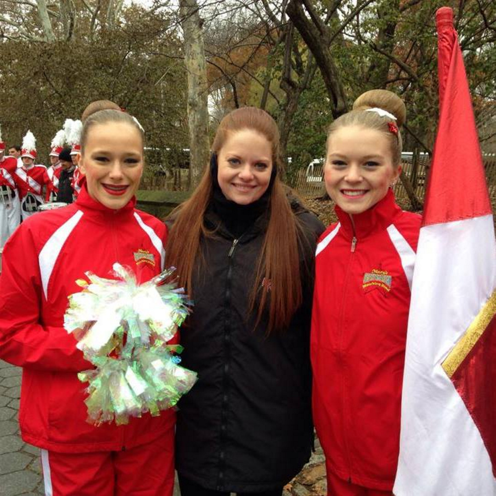 From left, Wells High School Color Guard dancer Anna Libby, squad director Bailey Smith and flag performer Adrienne Perron wait to step into the 2014 Macy’s Thanksgiving Day Parade in New York City. The team will return for an encore performance this year.
Photo courtesy Bailey Smith
