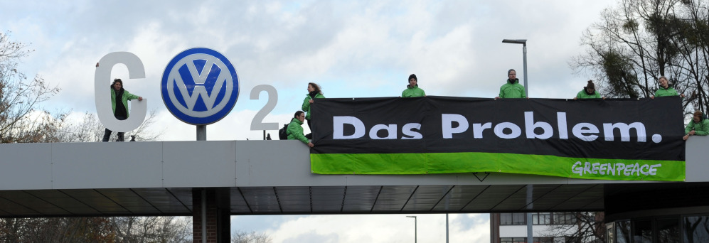 Greenpeace activists stand with ‘CO2’ formed with the VW logo and a banner that reads ‘the problem’ above the Volkswagen factory gate in Wolfsburg, Germany.
The Associated Press 
