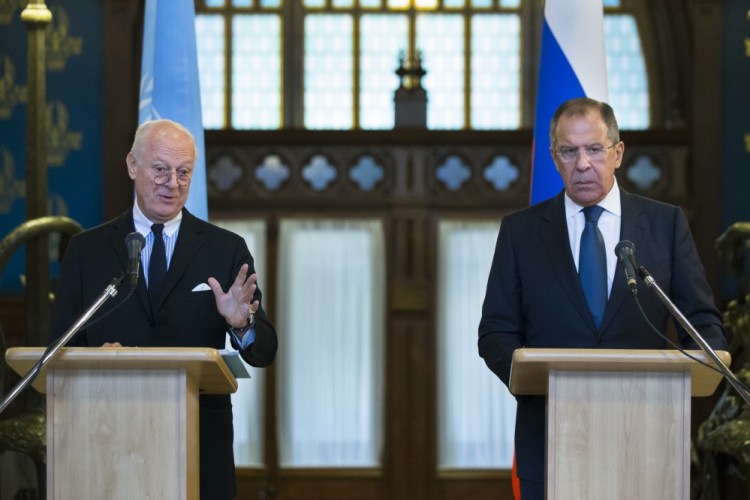 In this Wednesday, Nov. 4, 2015, file photo, Russian Foreign Minister Sergey Lavrov, right, listens as U.N. Special Envoy for Syria Staffan de Mistura speak during a news conference following their talks in Moscow.