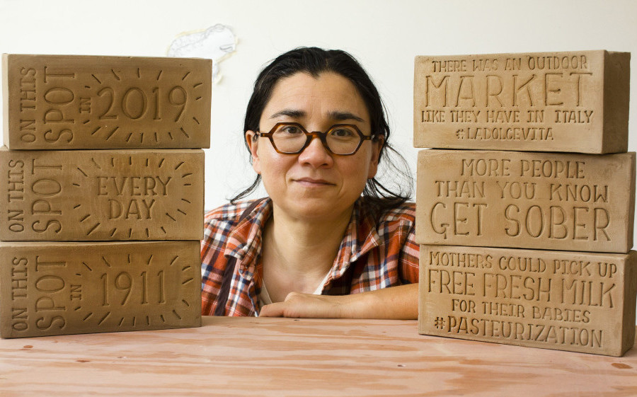 Potter Ayumi Horie, shown with bricks she created to tell stories about the India Street neighborhood in Portland, has received a $50,000 fellowship.