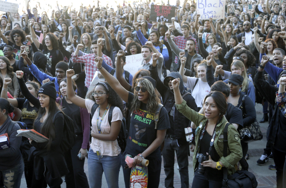 University of California Los Angeles students stage a protest in a show of solidarity with protesters at the University of Missouri on Thursday in Los Angeles. Thousands of students across the U.S. took part in demonstrations at university campuses.