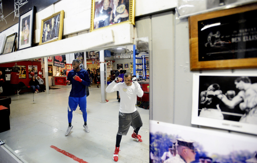 Russell Lamour, left, and Jorge Abiague Jr., both prized members of the Portland Boxing Club, will be featured in title fights Saturday night at the Portland Exposition Building. Shawn Patrick Ouellette/Staff Photographer