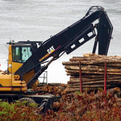 Logs are loaded onto a pulp truck bound for the Madison Paper Industries mill in Madison last month. The U.S. Commerce Department released an analysis Thursday of the impact of the Trans-Pacific Partnership on Maine. According to the federal agency, the trade pact could increase exports by millions, especially in sectors such as  forest products, which tallied more than $700 million in exports in 2014. David Leaming/Morning Sentinel file