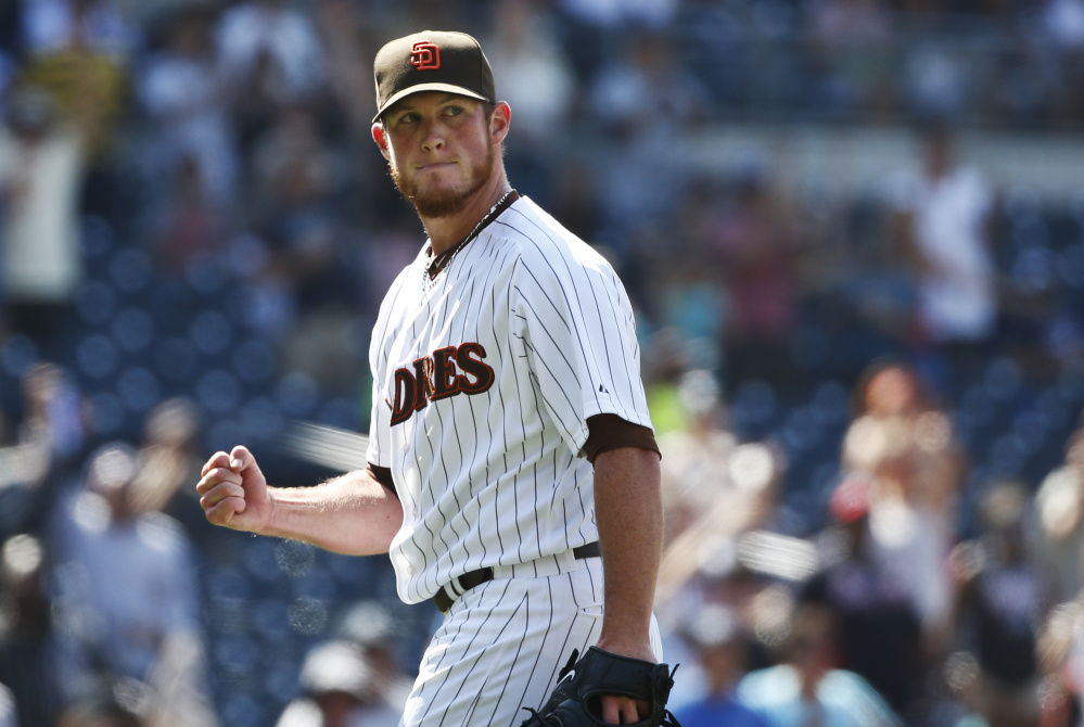 San Diego Padres closer Craig Kimbrel pumps his fist as he watches the final out in the Padres' 3-2 victory over the Atlanta Braves on Aug. 19 in San Diego. The Associated Press