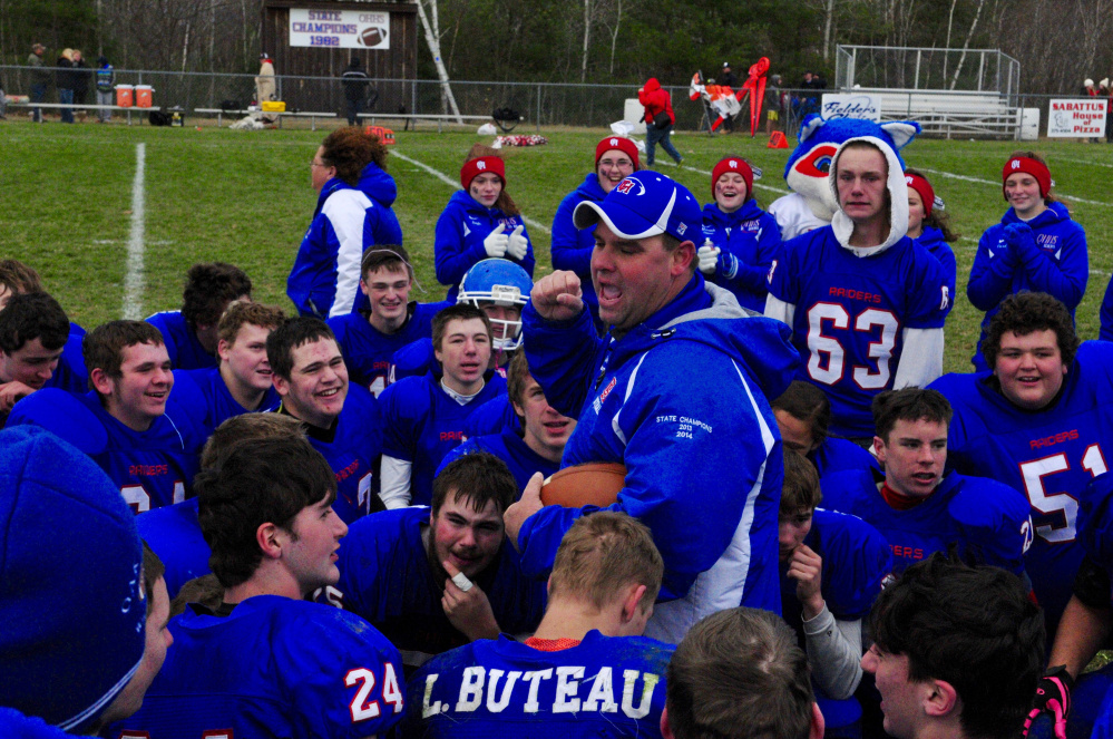 Stacen Doucette, Oak Hill coach, talks to his players after the Raiders beat Lisbon in the Class C South championship. 