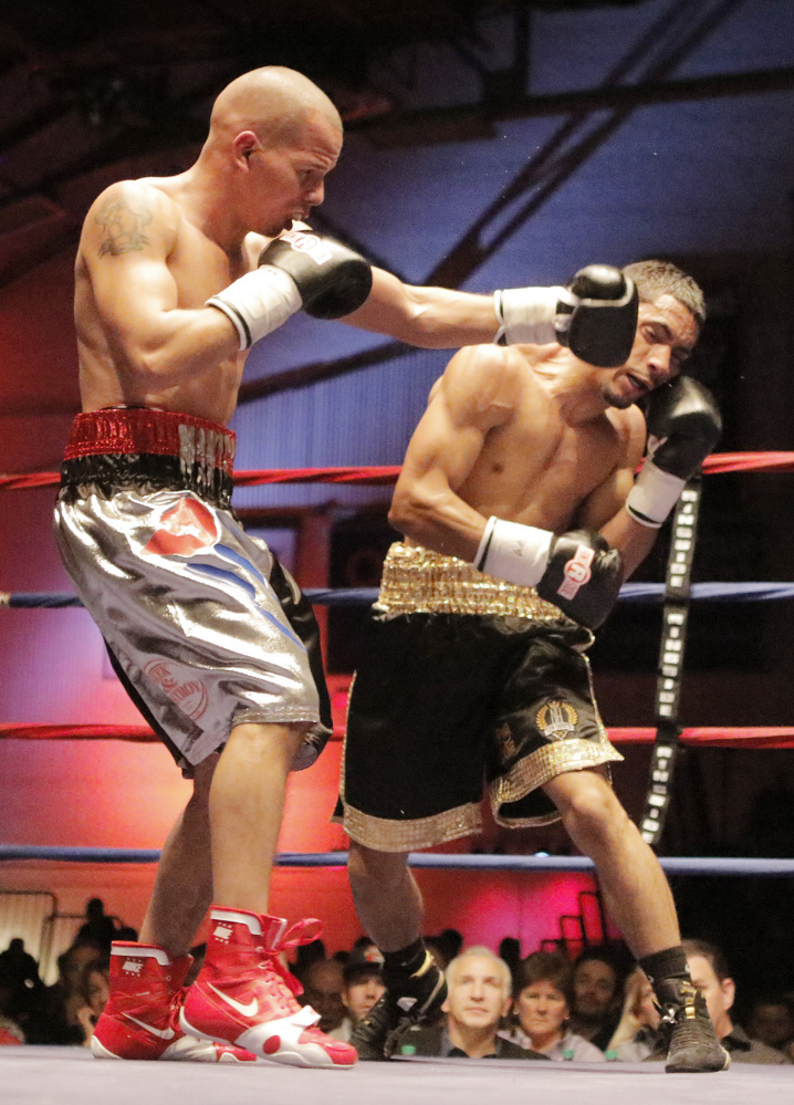 Jorge Abiague, left, fights Josh Crespo at the Portland Expo on Saturday. Abiague lost his New England super bantamweight title to Crespo on a unanimous decision.