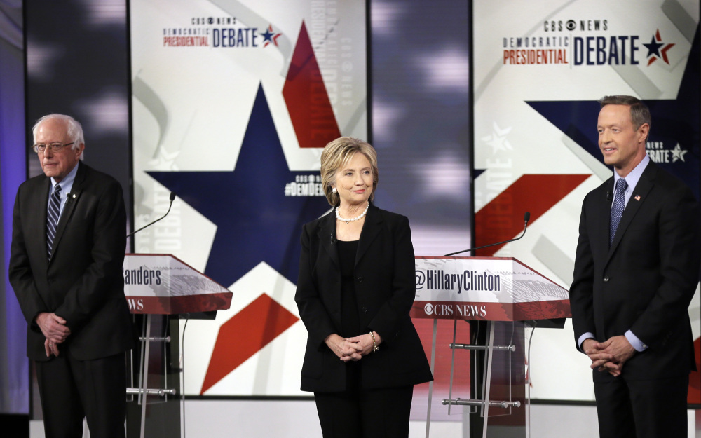 Democratic presidential candidates Bernie Sanders, left, Hillary Rodham Clinton and Martin O’Malley take the stage Saturday at the Democratic presidential primary debate in Iowa.