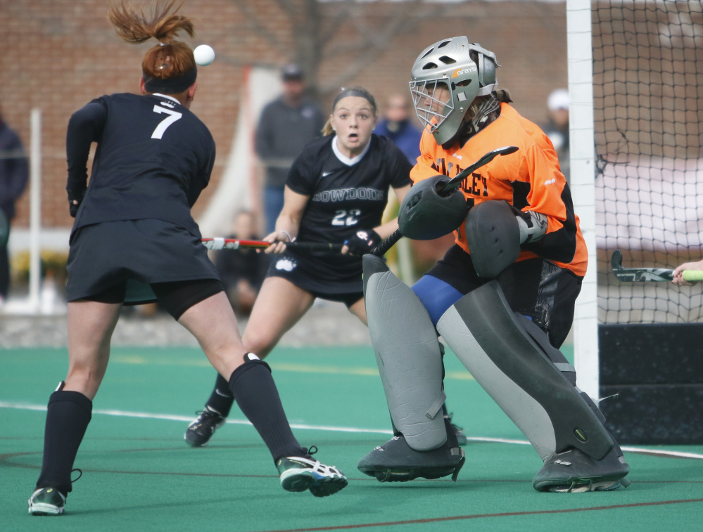 Liz Znamierowski, left, takes a shot as teammate Kimmy Ganong and Wellesley goalie Lucy Hurlock keep their eyes on the ball. Ganong scored Bowdoin’s final goal in the 3-0 victory.