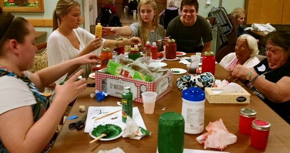 Sanford High School Key Club members, from left, Tiphanie Little, Marissa Nance, Isabella Troop and Michael Lunny create crafts with residents of Newton Center in Sanford.