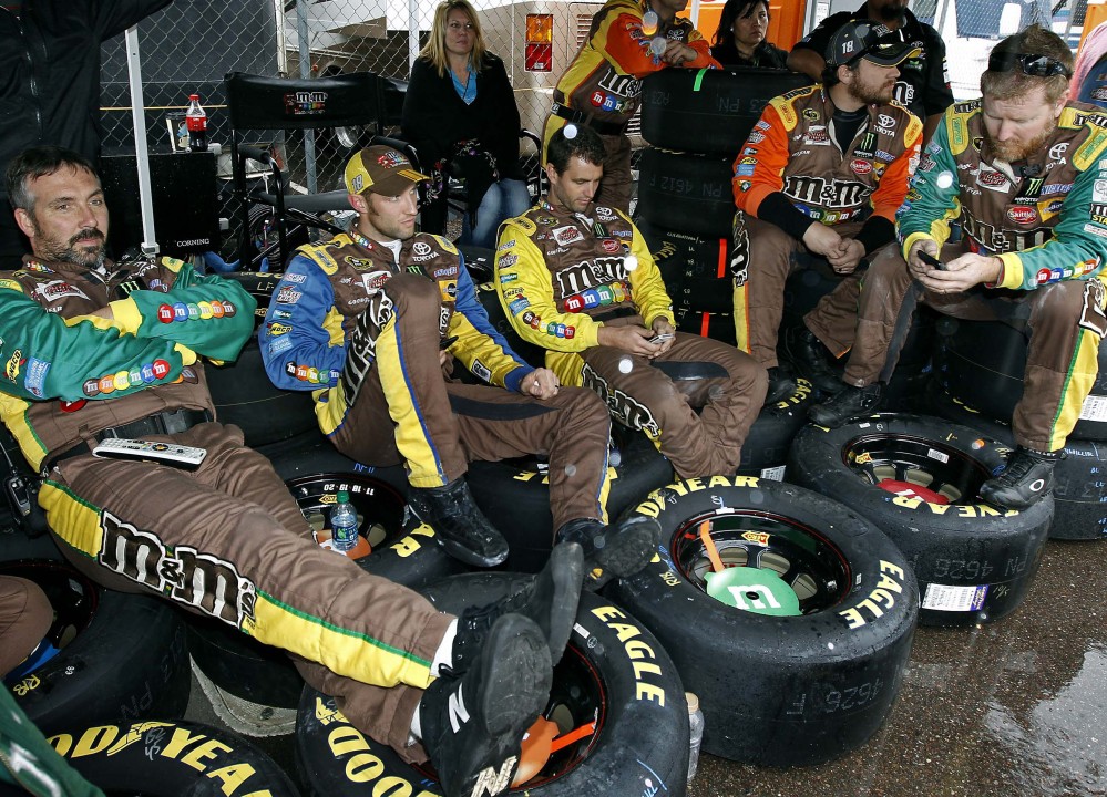Pit crew members for Kyle Busch had to sit on their racing tires while waiting out a rain delay at the NASCAR Sprint Cup race Sunday at Phoenix International Raceway.