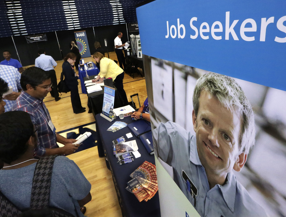 Students seeking entry into the workplace, such as these at The Foot in the Door Career Fair at the University of Illinois last year, might find more opportunities in 2016 as the national economy seems to be picking up steam.