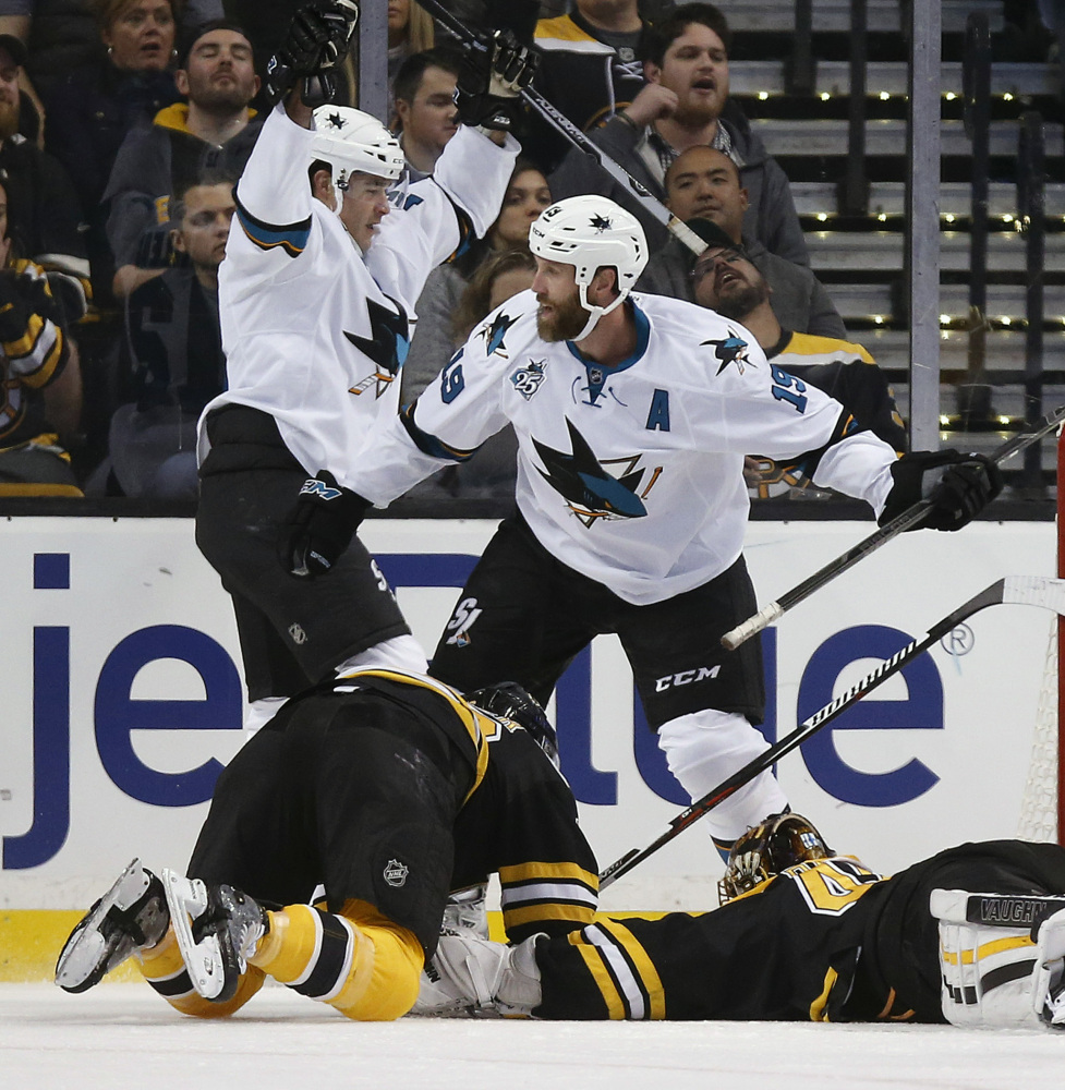 San Jose’s Patrick Marleau, back left, celebrates his goal with teammate Joe Thornton (19) in the second period.
