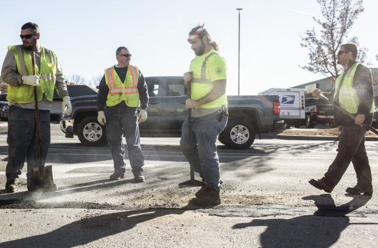 Don Noyes, left, Ralph Dobson, Matthew Fernald and Eric Stanicki now do road work for the Portland Department of Public Works, since the city reversed a 2008 name change that has caused confusion.