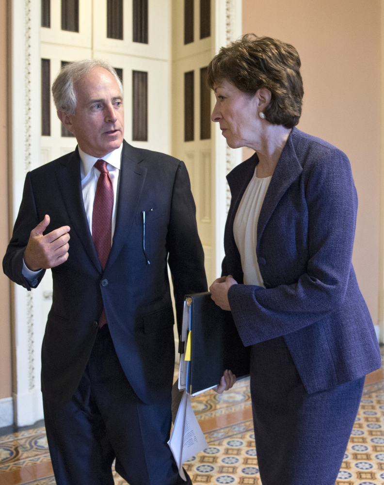 Sen. Susan Collins, R-Maine, confers with Senate Foreign Relations Committee Chairman Sen. Bob Corker, R-Tenn., Wednesday on Capitol Hill.