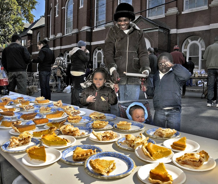 Betty Lasu and her family check out the pie selection at a Parkside block party in 2009. There is much to celebrate about the Portland neighborhood, a homeowner says.