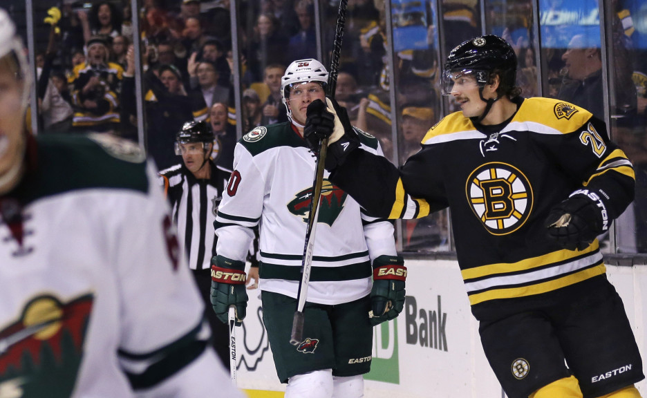 Bruins left wing Loui Eriksson skates past Minnesota Wild defenseman Ryan Suter after scoring his first of three goals in Thursday night’s game, during the second period.