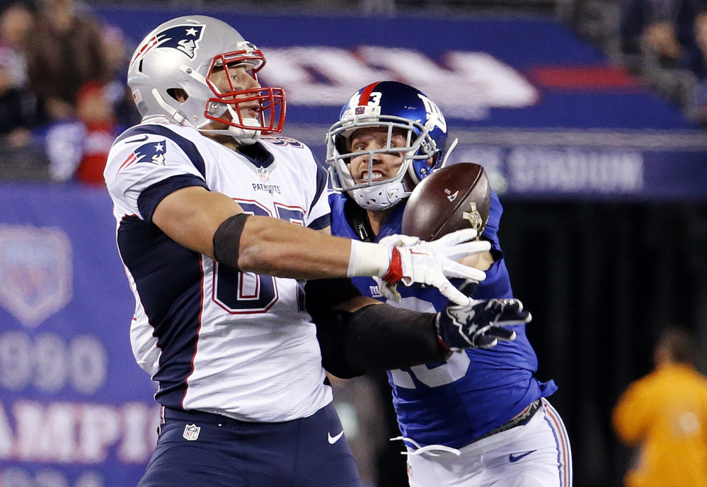This pass was broken up by Giants defensive back Craig Dahl last Sunday, but Patriots tight end Rob Gronkowski already has 49 catches for 806 yards this season, so he has no plans to change his game to avoid penalties.