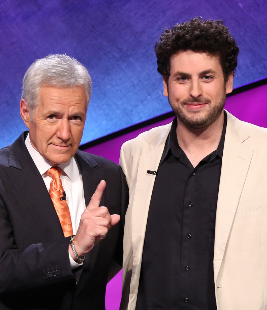 “Jeopardy!” host Alex Trebek, left, appears with Alex Jacob, winner of the “Tournament of Champions.”