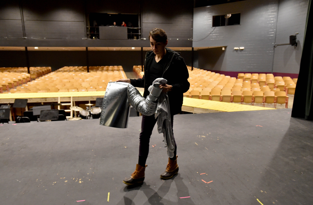 Alan Baez carries a portion of his Tin Man costume across the stage at Trask Auditorium.