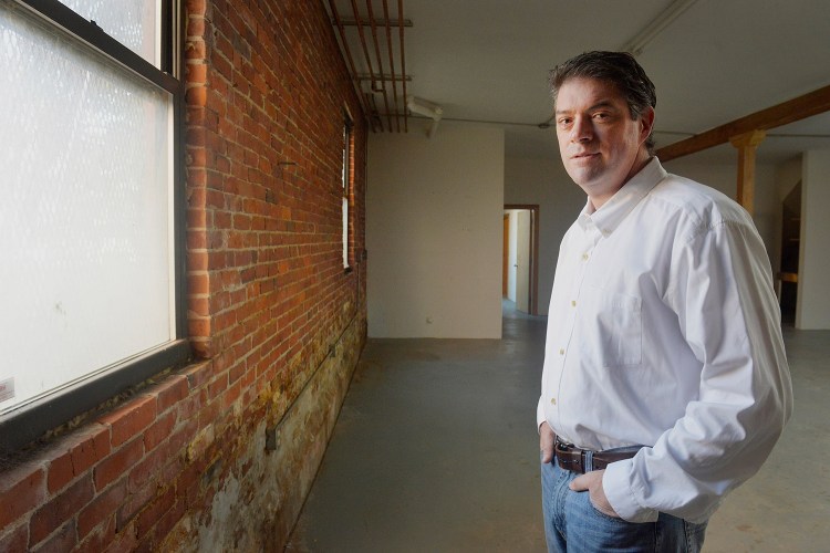 Kevin Dwyer stands in the empty building at 273 Congress St., which he and his partners planning to convert to retail space and condo units.
John Ewing/Staff Photographer