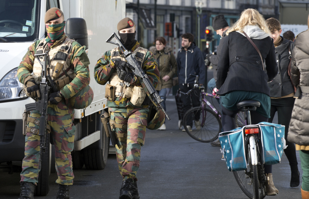 Belgian Army soldiers patrol the center of Brussels on Monday.