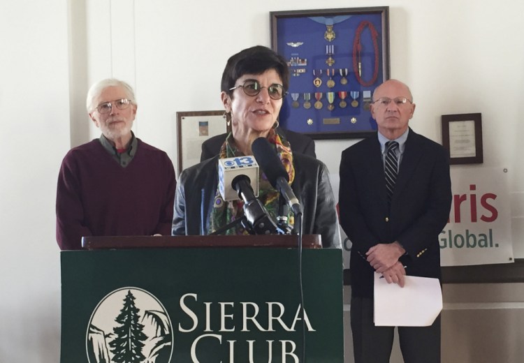 Catherine Lee of North Yarmouth speaks at a news conference Monday at Portland City Hall about the importance of addressing climate change. She’ll be among the Mainers going to a conference in Paris.