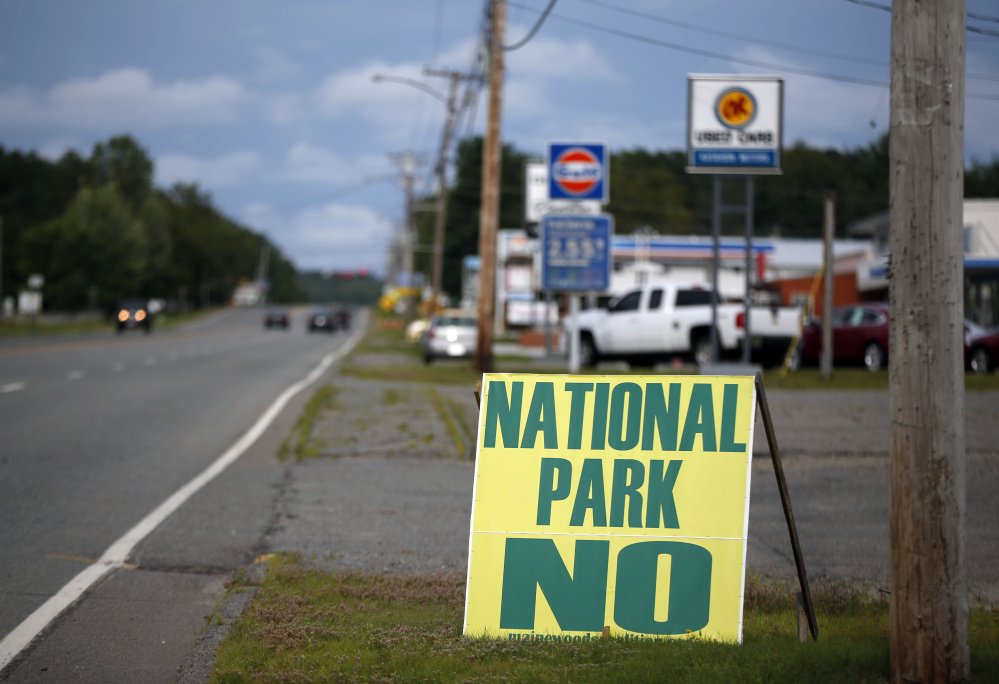 Opposition to a national park is seen on a sign on a road leading into Millinocket in August. Reaction to the national park proposal has been mixed.
The Associated Press