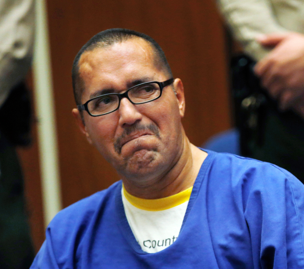 Luis Vargas, who has served in prison for 16 years on rape charges, reacts in court as he is exonerated Monday in Los Angeles.