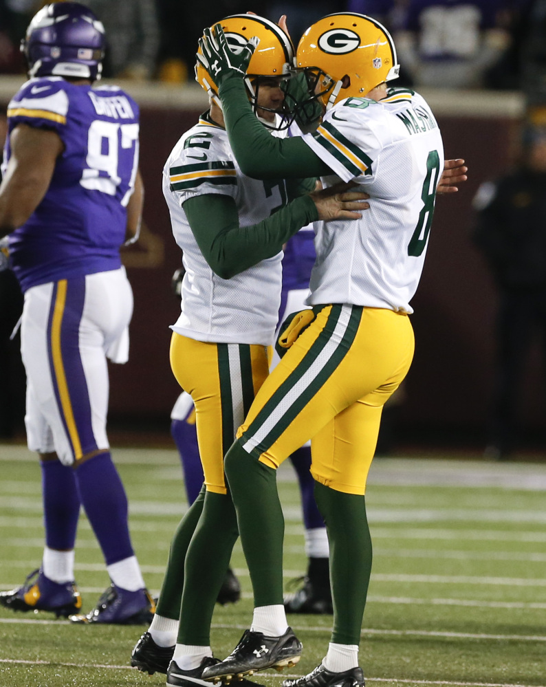 Green Bay kicker Mason Crosby, left, was fairly busy in a 30-13 win over the Vikings on Sunday, but the defense was superb in holding Minnesota to 94 yards rushing.
