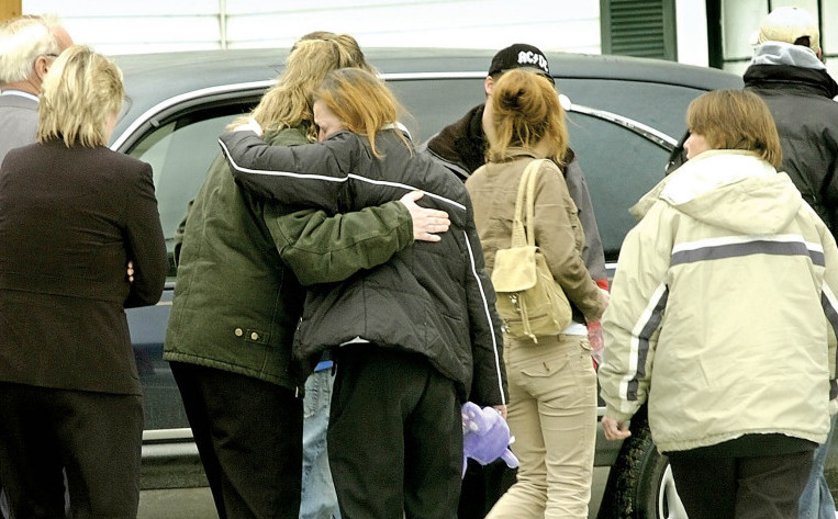 Mourners hug after Amy Drake’s funeral in December 2006 in Skowhegan. Drake’s body was found Nov. 24, 2006, two months after she was last seen. Police have never named a suspect, but say the case remains active.
