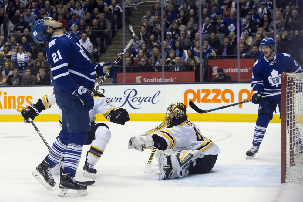 The Maple Leafs’ James van Riemsdyk, left, reacts after getting stopped by Bruins goaltender Tuuka Rask at the end of overtime. The game went to a shootout and the Bruins won.