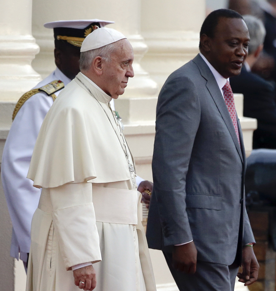 Pope Francis is greeted by Kenya’s President Uhuru Kenyatta, right, at Nairobi’s State House on Wednesday.