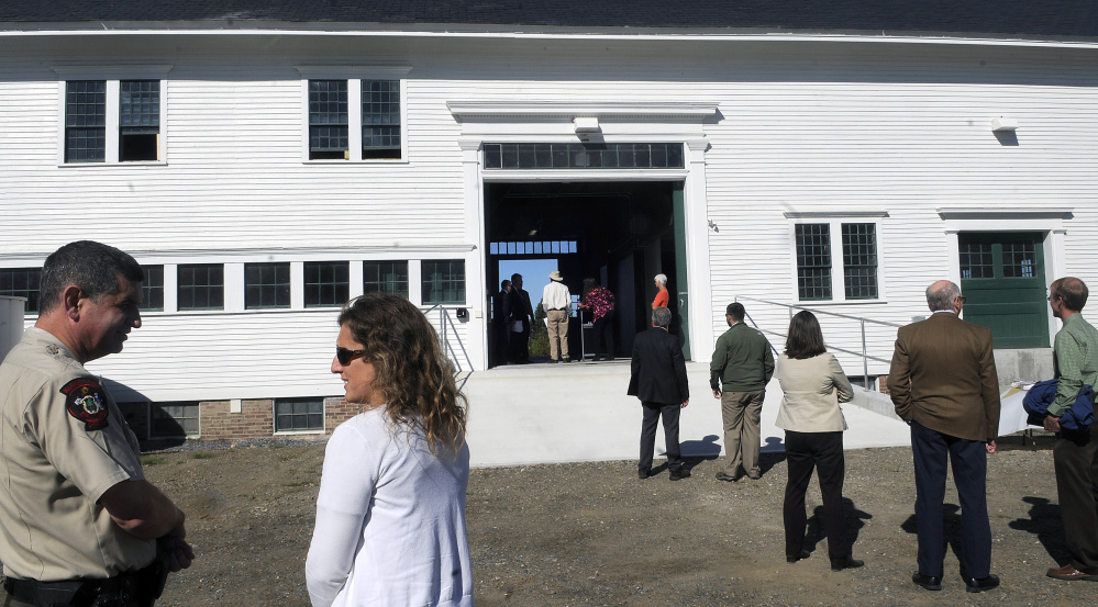 State officials gather in September outside the Campbell Barn in Augusta during a dedication ceremony for the renovated structure at the state complex on the east side of Augusta. The project was honored by Maine Preservation last week, one of 16 in the state recognized by the organization.
