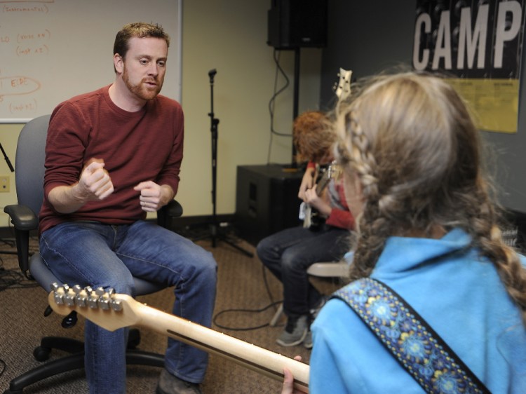 Just as donations to nonprofits were about to drop off during the recession, Jeff Shaw started a music school in Portland – and has managed to make it work. Here, he instructs guitar player Greta Holmes, 10, of Portland.