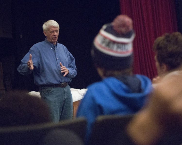 Dick Capp, who played in a legendary Thanksgiving Day game for Deering in 1959 and then went on to play in a Super Bowl, speaks to Deering High students Wednesday.