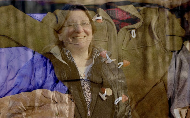 One of Jessica Maurer’s projects for the Maine Association of Area Agencies on Aging is keeping seniors warm in winter by providing them with coats, like the one at L.L. Bean superimposed above.
Gabe Souza/Staff Photographer