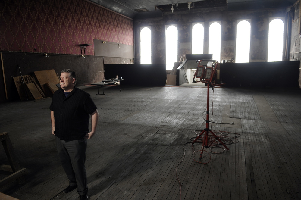 Mike Miclon stands on the third floor at the Johnson Hall Performing Arts Center, which is undergoing renovations, in May 2014.