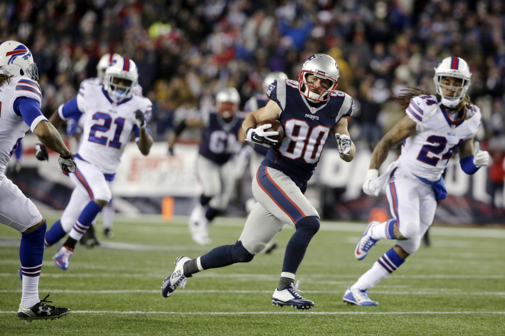 New England Patriots wide receiver Danny Amendola (80) runs after catching a pass against the Buffalo Bills. Amendola did not travel with the Patriots to Denver because of a knee injury. (The Associated Press)