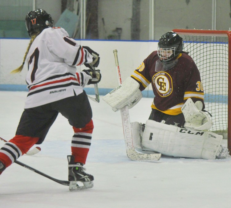 Cape Elizabeth goalie Abby Joy, who stopped 20 shots, makes a pad save on a scoring bid by Taylor Veilleux of Scarborough.