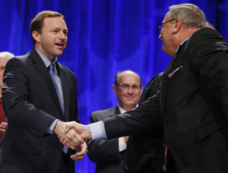 Gov. LePage greets state Rep. Mark Eves before taking the oath of office in January. A reader is deeply troubled that no official action has been taken on the Good Will-Hinckley matter.