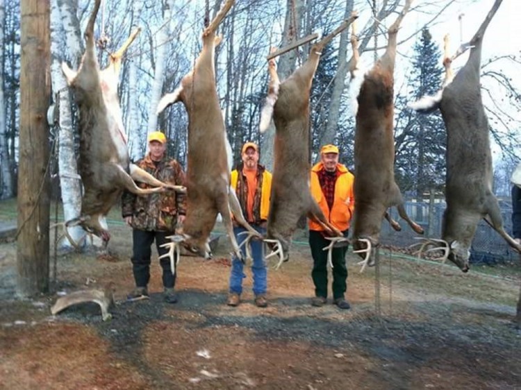 Hunters at 15 Mile Stream Lodge in The Forks the week before last bagged six deer weighing more than 200 pounds in three days. Shown with some of them are, from left, Paul McDonald of Tewksbury, Mass.; Shane Crommett, owner of 15 Mile Stream Lodge; and Robert Ward of Andover, Mass. Local business owners who cater to deer hunters say this year’s good season has helped boost the economy of northern Somerset County.