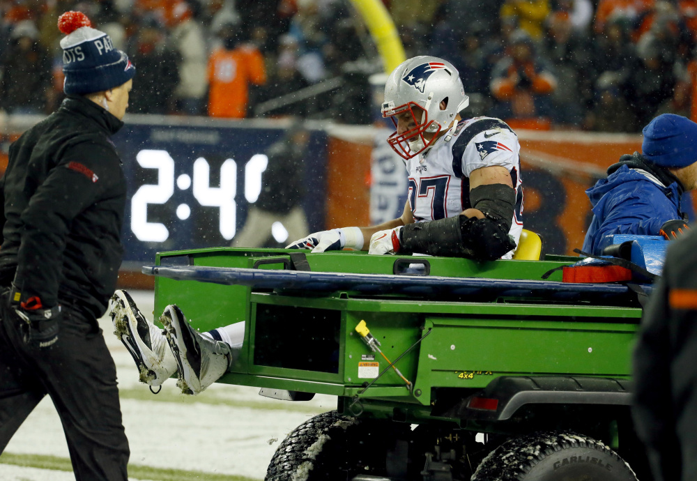New England Patriots tight end Rob Gronkowski is carted off the field after being injured against the Denver Broncos during the second half Sunday  in Denver. The Associated Press