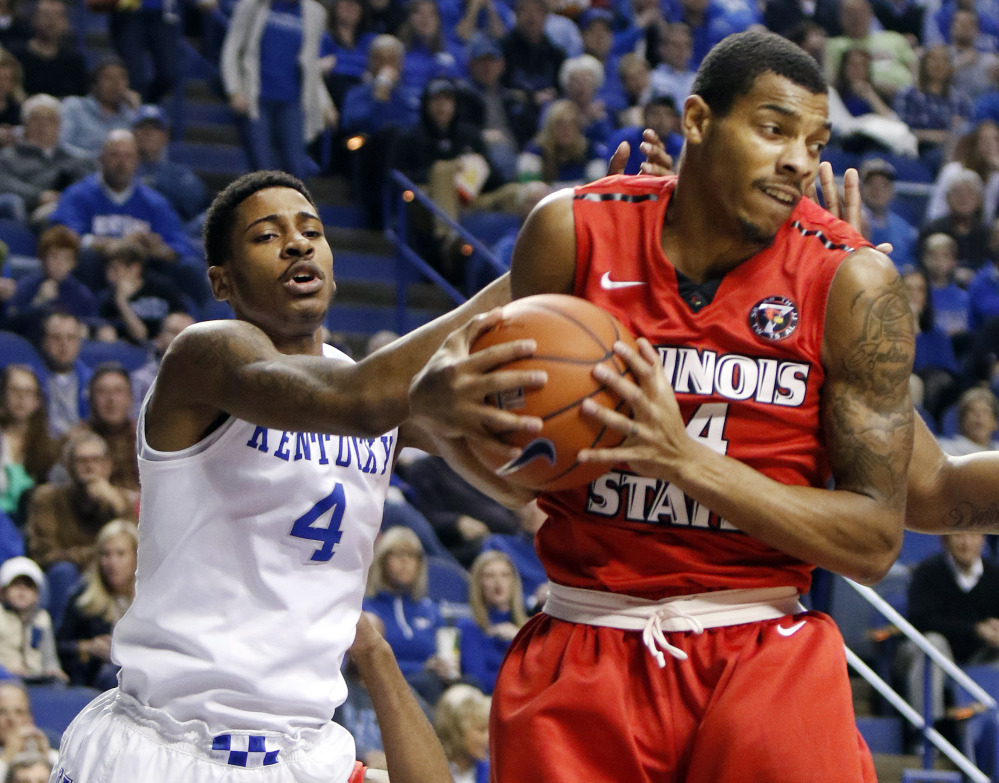 Illinois State's DeVaughn Akoon-Purcell, right, pulls down a rebound next to Kentucky's Charles Matthews (4) during the first half of an NCAA college basketball game Monday, Nov. 30, 2015, in Lexington, Ky. (AP Photo/James Crisp)