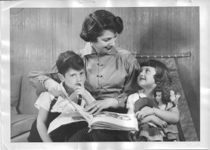 Judith Isaacson reads to her son, John, and daughter, Ilona.